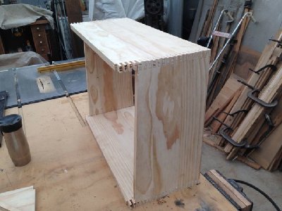 The boards are placed not glued to check for size and square.  top and bottom need trimmed before gluing